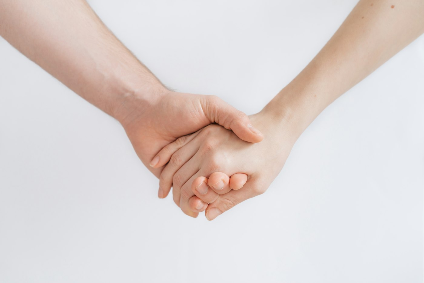 Woman and man holding hands