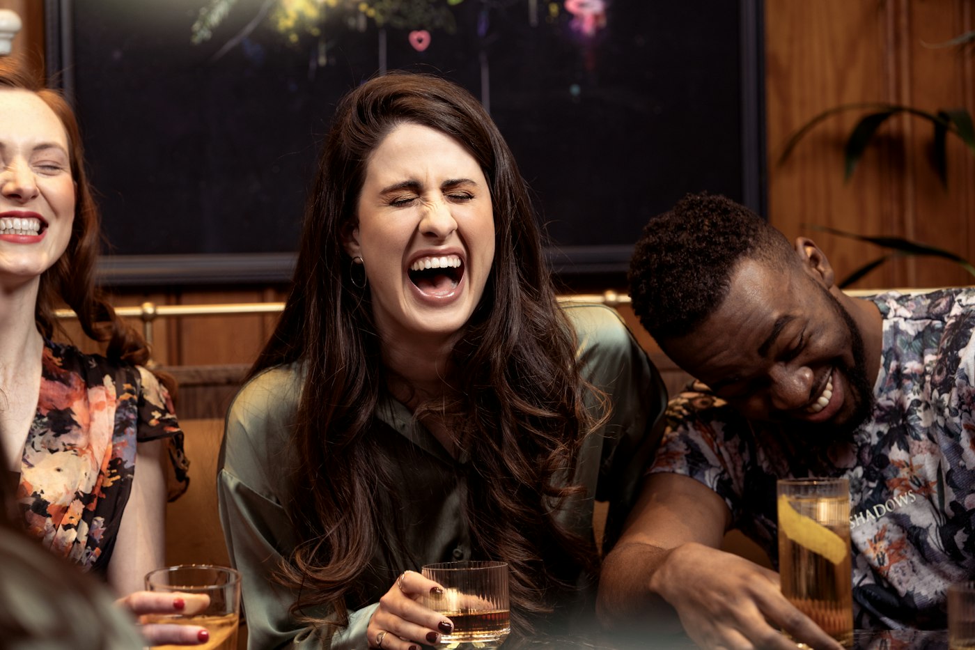 A group of people sitting around a table with drinks